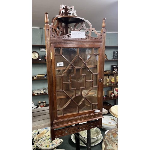 273 - Multi-glazed fretwork framed wall mounted corner cupboard.