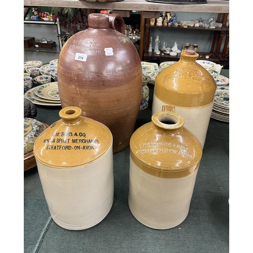 276 - 4 stone ware jugs all with local interest - Approx heights 50cm  39cm  32cm  30cm