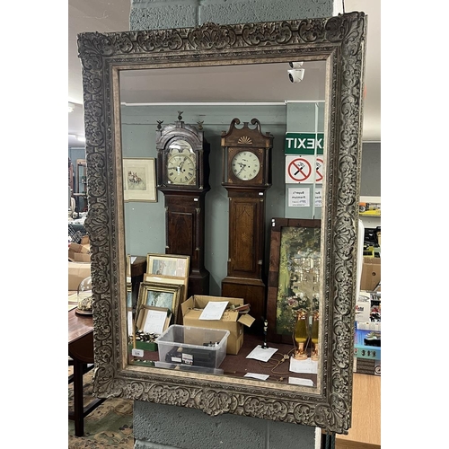 335 - Large bevelled glass mirror in ornate frame