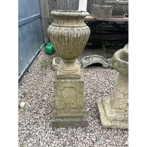 513 - Stone urn shaped planter on plinth