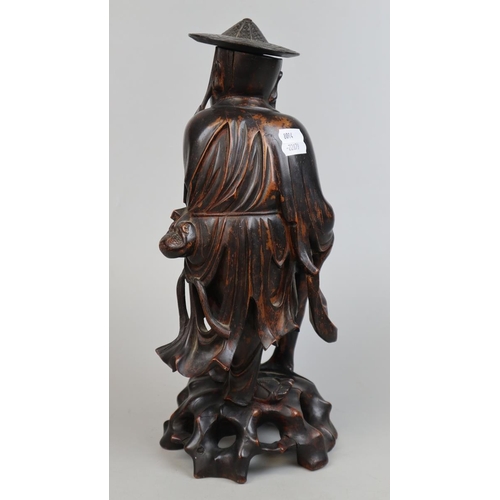 144 - Hand carved hardwood Oriental gentleman - Approx height 37cm