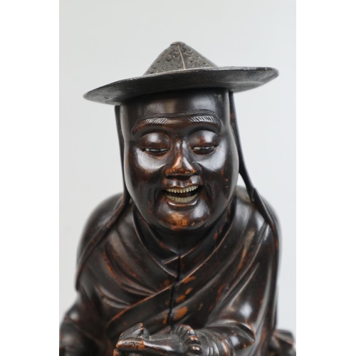 144 - Hand carved hardwood Oriental gentleman - Approx height 37cm