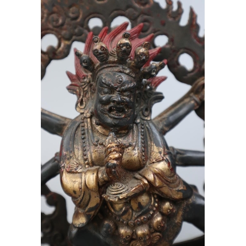 153 - Antique Tibetan gilt bronze Deity holding skulls - Approx height 27cm