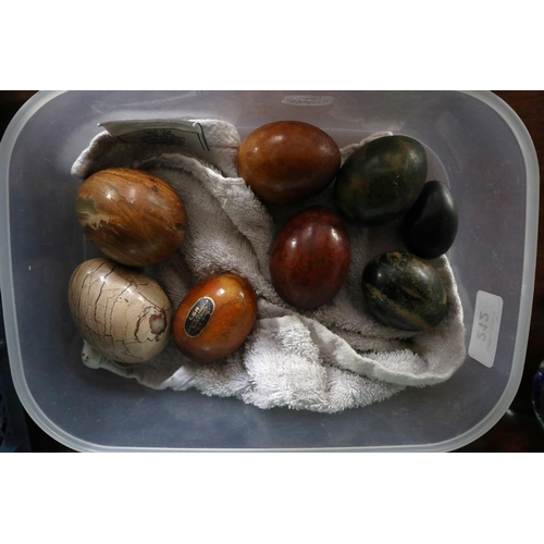 Collection of glass paperweights and stone eggs to include reverse hand ...