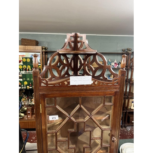 273 - Multi-glazed fretwork framed wall mounted corner cupboard.