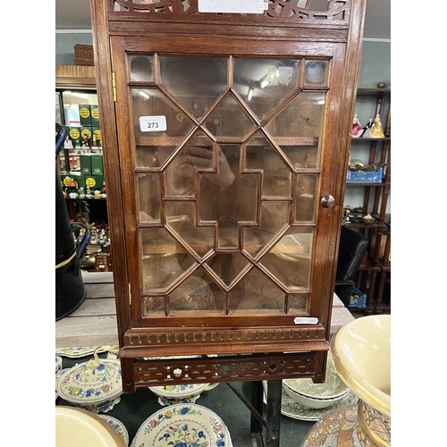 273 - Multi-glazed fretwork framed wall mounted corner cupboard.