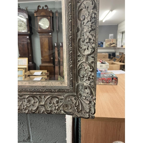 335 - Large bevelled glass mirror in ornate frame