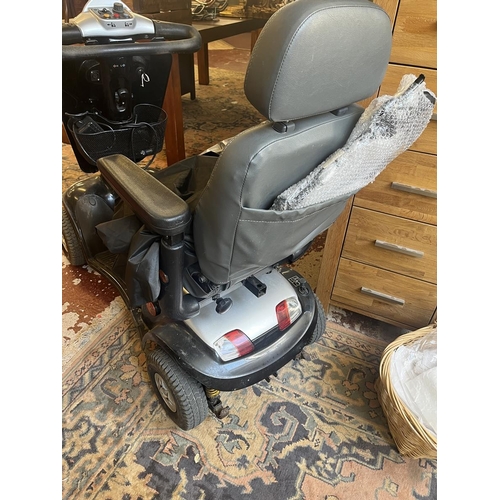 421 - GEO8 mobility scooter together with charger, cover and spare handle in good working order