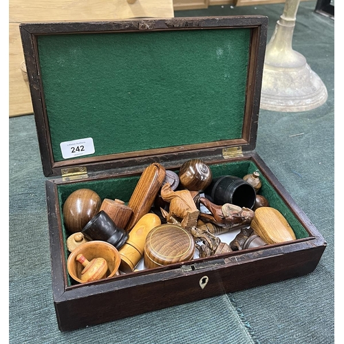 242 - Mahogany box with brass 'Bale' handle containing superb carved treen examples Inc. black forest figu... 