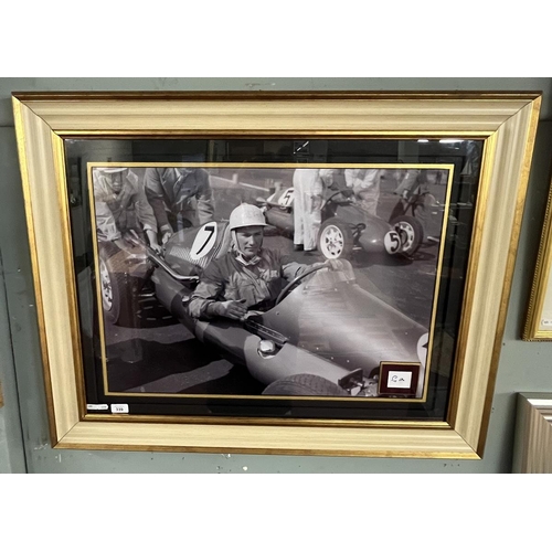 339 - Large framed photograph of Sterling Moss. Signed by him with COA to verso - Approx size: 96cm x 76cm