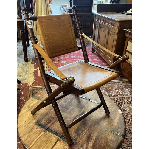 414 - Unusual bamboo effect leather and brass folding chair