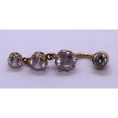 63 - 9ct gold stone set belly bar