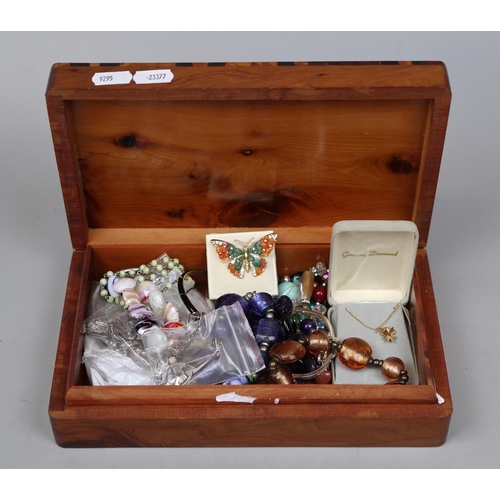 94 - Burr walnut and mother-of-pearl jewellery box containing jewellery, with some silver and semi precio... 