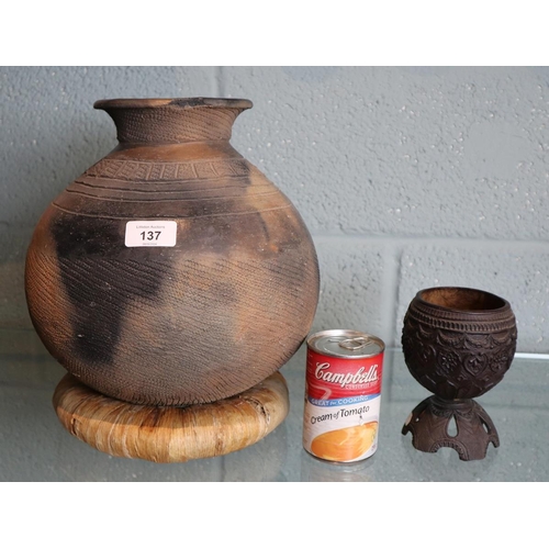 137 - Tribal water container together with carved coconut goblet