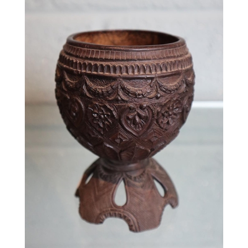 137 - Tribal water container together with carved coconut goblet