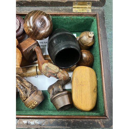 242 - Mahogany box with brass 'Bale' handle containing superb carved treen examples Inc. black forest figu... 