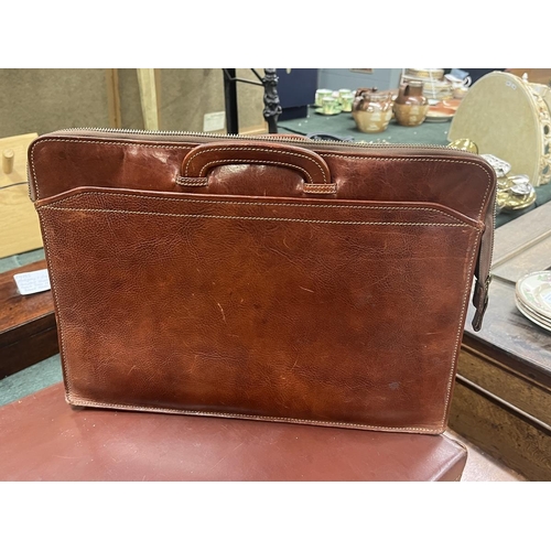 243 - Vintage leather suitcase, in as new condition, with key plus 2 1970's leather Attaché and bri... 