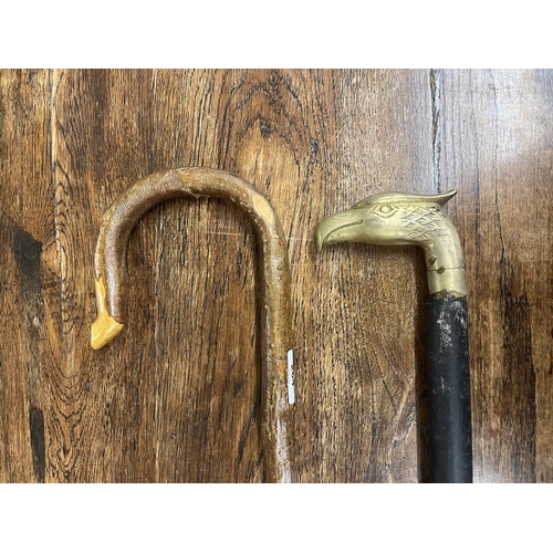 264 - Shephard's crook together with a walking stick with Eagle head