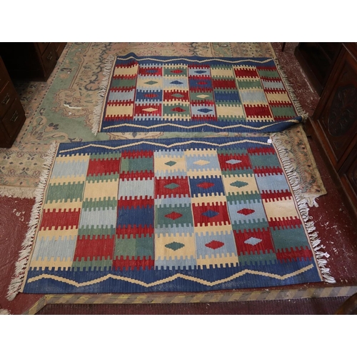 301 - Pair of multi-coloured kilim patterned rugs - Approx size: 172cm x 118cm