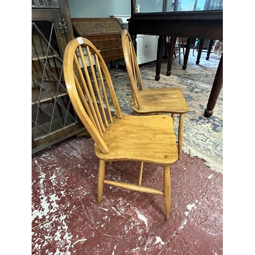 348 - Pair of Ercol blonde elm chairs