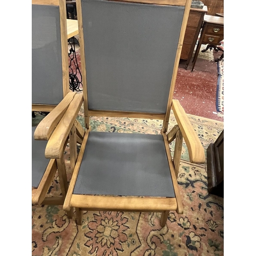 422 - Pair of teak garden chairs
