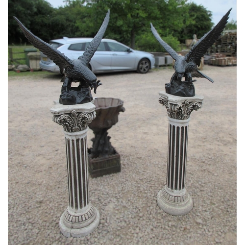 104 - Pair of cast iron eagles on stone plinths - Approx Height: 163cm Wingspan: 67cm