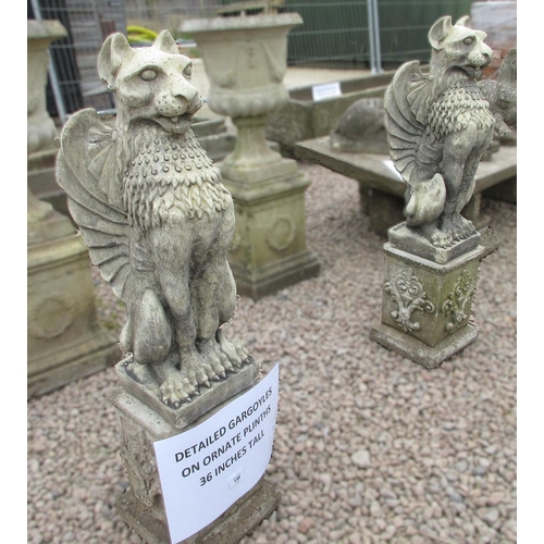 158 - Detailed stone griffins on stone plinths - Approx Height: 91cm