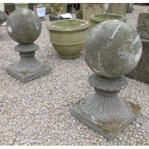 168 - Pair stone of large round finials