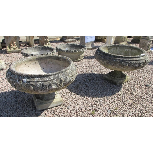 171 - Pair of large round planters on plinths 