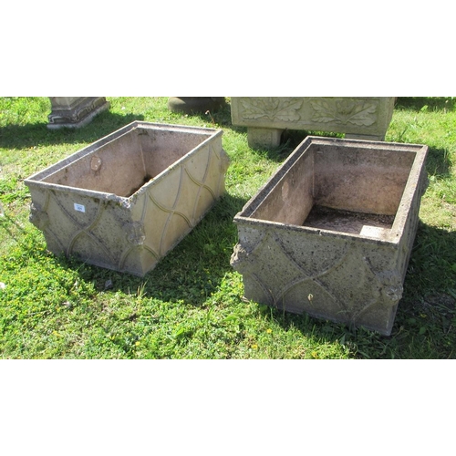 201 - Pair of decorative stone planters adorned with lions head
