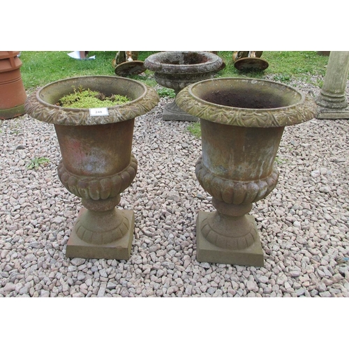 248 - Pair of small cast-iron urns