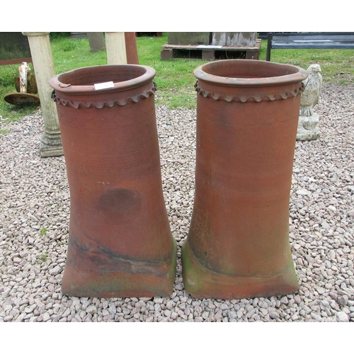 249 - Pair of terracotta chimney pots with decorative tops - Approx Height: 70cm