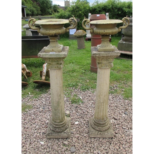 250 - Pair of Victorian miniature cast iron urns on stone Roman Greco column plinths