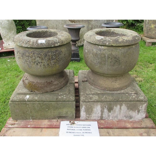 265 - Antique natural stone goblet urns on natural stone plinths