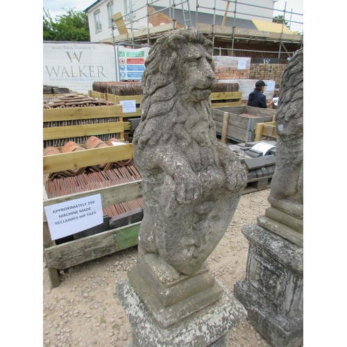 107 - Pair of heraldic stone lions on plinths - Approx Height: 137cm