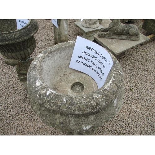148 - Antique stone putti holding an urn - Approx Height: 107cm Diameter: 56cm