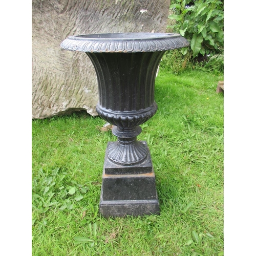 263 - A set of 3 fluted cast-iron urns on pedestals - Approx Height: 72cm  Diameter: 41cm