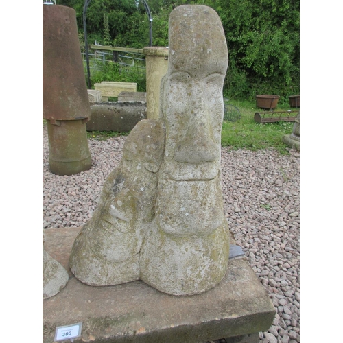 300 - Easter Island heads on pedestal base with stone legs