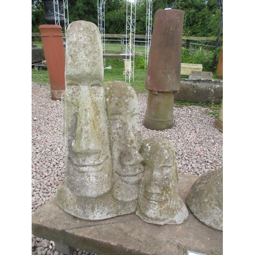 300 - Easter Island heads on pedestal base with stone legs