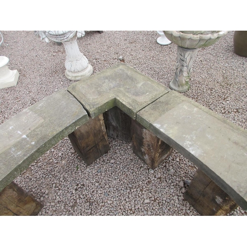 301 - Stone corner bench on wooden pedestal legs