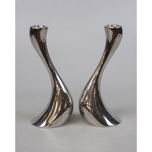 124 - Pair of Georg Jenson Cobra stainless steel candlesticks