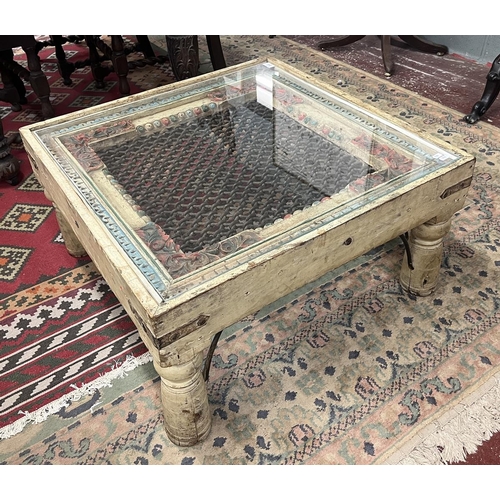 280 - Interesting carved coffee table with glass top