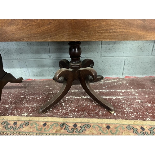 273 - Early mahogany drop leaf table with drawer on splayed support with brass castors