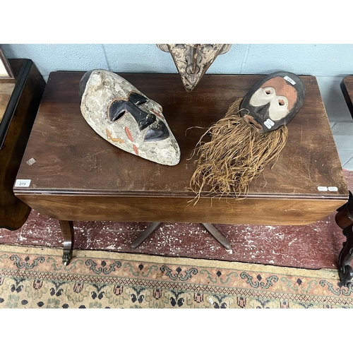 273 - Early mahogany drop leaf table with drawer on splayed support with brass castors