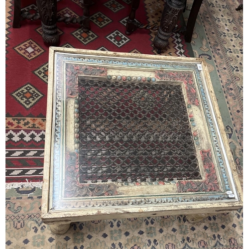 280 - Interesting carved coffee table with glass top