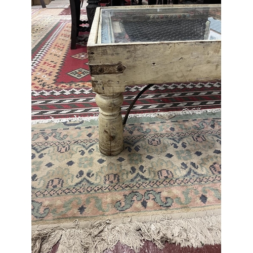 280 - Interesting carved coffee table with glass top