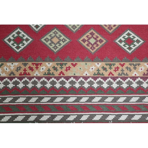 281 - Large red patterned rug - Approx size 265cm x 165cm