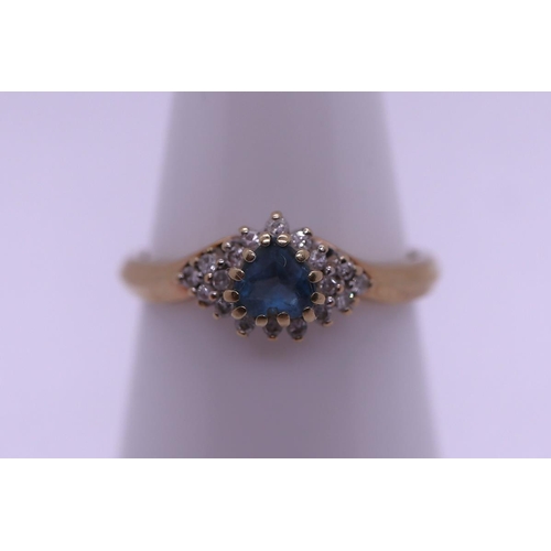 32 - 9ct gold blue topaz and diamond ring - Size L½
