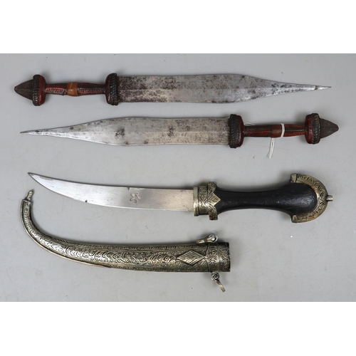 179 - 2 Central Sahara Chad 'tebu' tribal daggers with plaited leather handles, plus Moroccan jambhiya in ... 