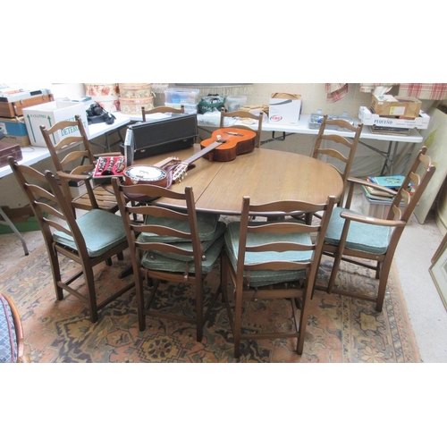 458 - Ercol extending dining table with 8 matching chairs